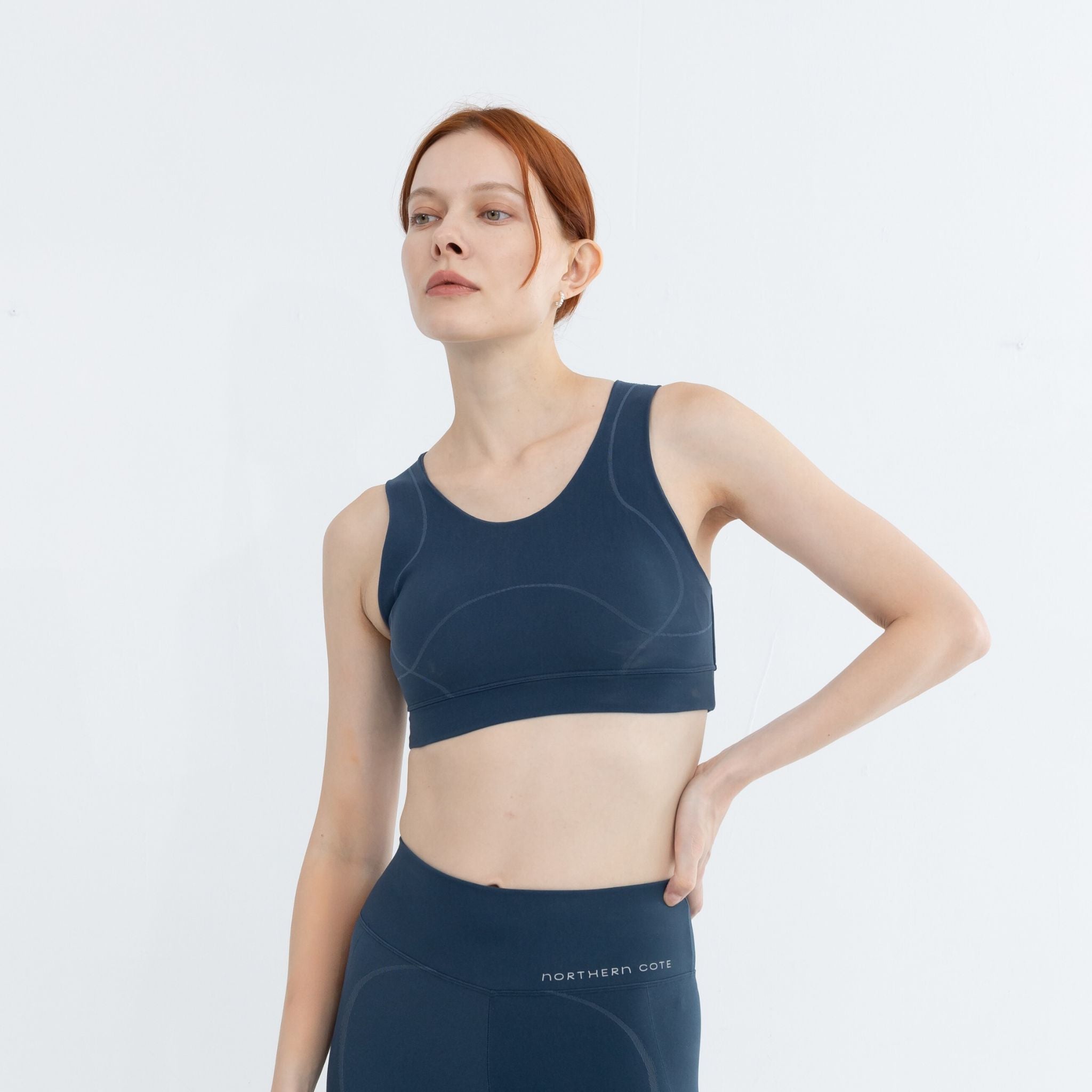 Model stretching in high quality medium impact activewear bra