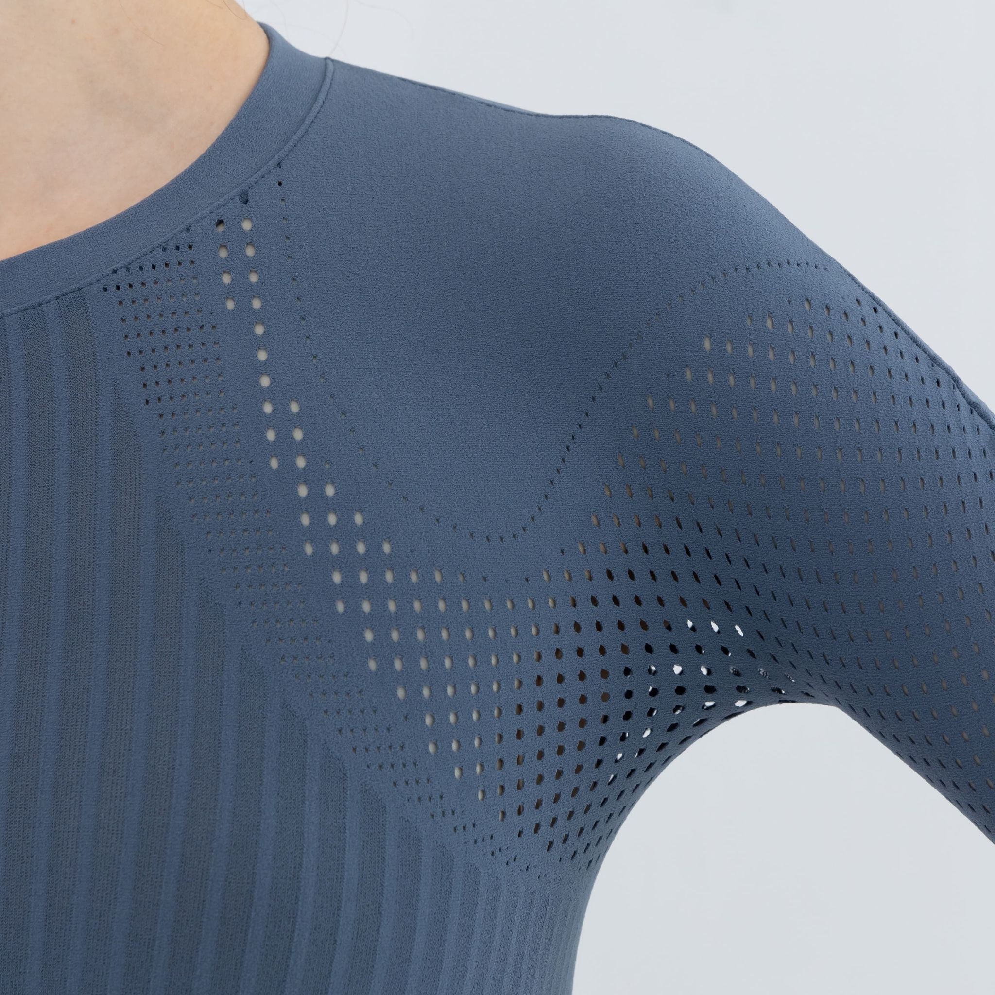 Close-up of neckline and shoulder details on cropped pullover