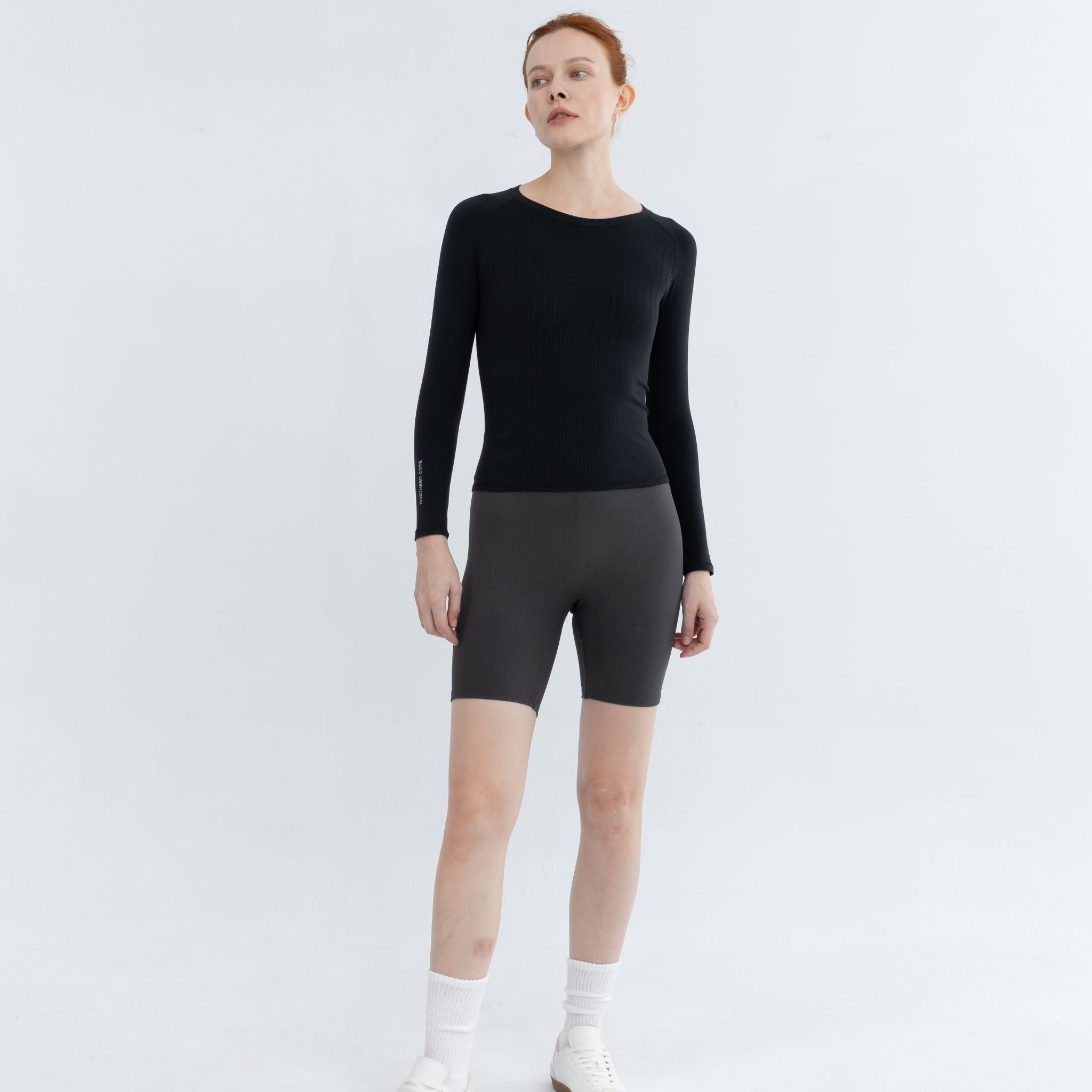 Front pose showcasing fitted Exercise Pullover design