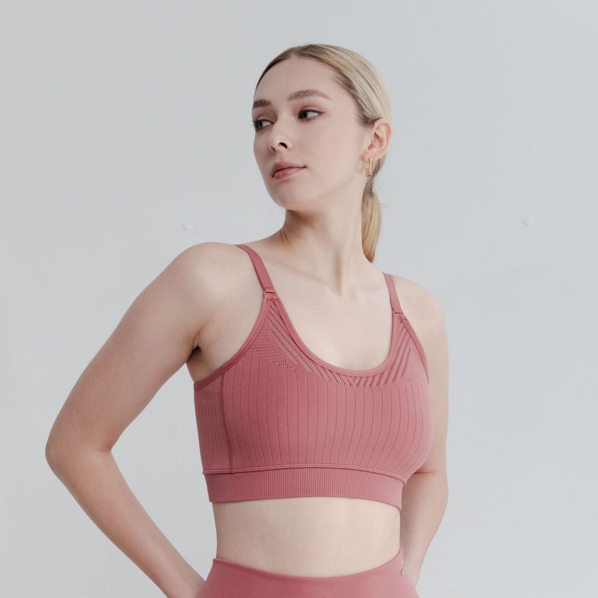 Side angle shot of open back bras highlighting the flexible fabric and secure fit for a confident feel.