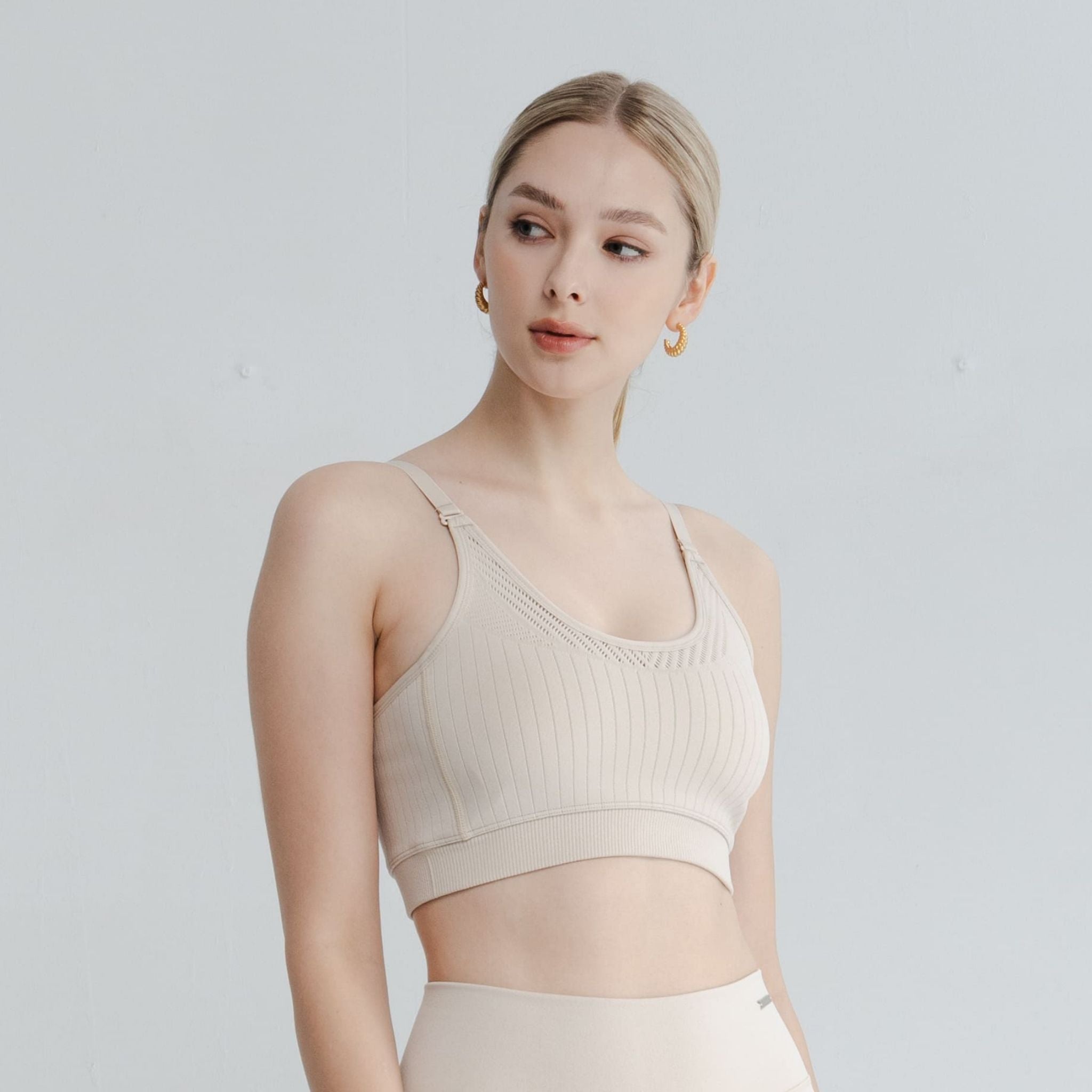 Side view of the open bralette showcasing breathable fabric, open back bra variations, and light-intensity support structure.