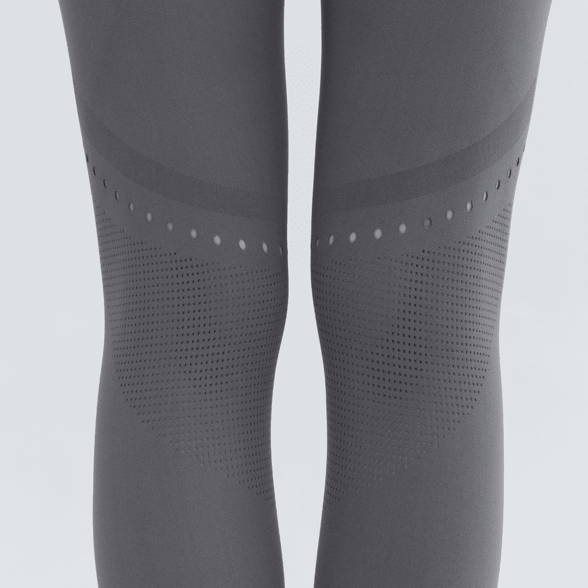 Close-up of the gray seamless leggings, highlighting the vertical dotted line running down the leg.