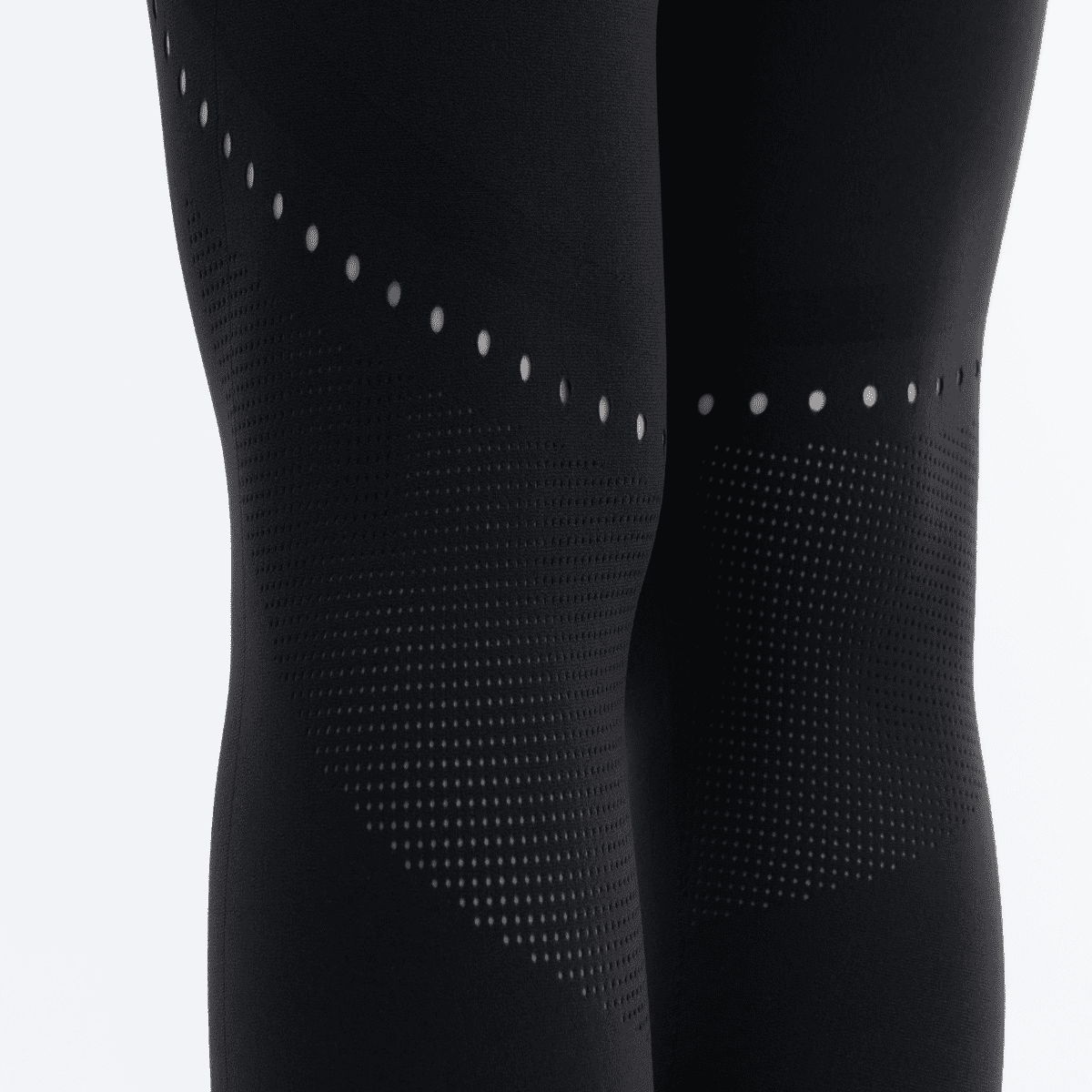 Back view of black seamless leggings, showing the dotted pattern along the back of the thighs.