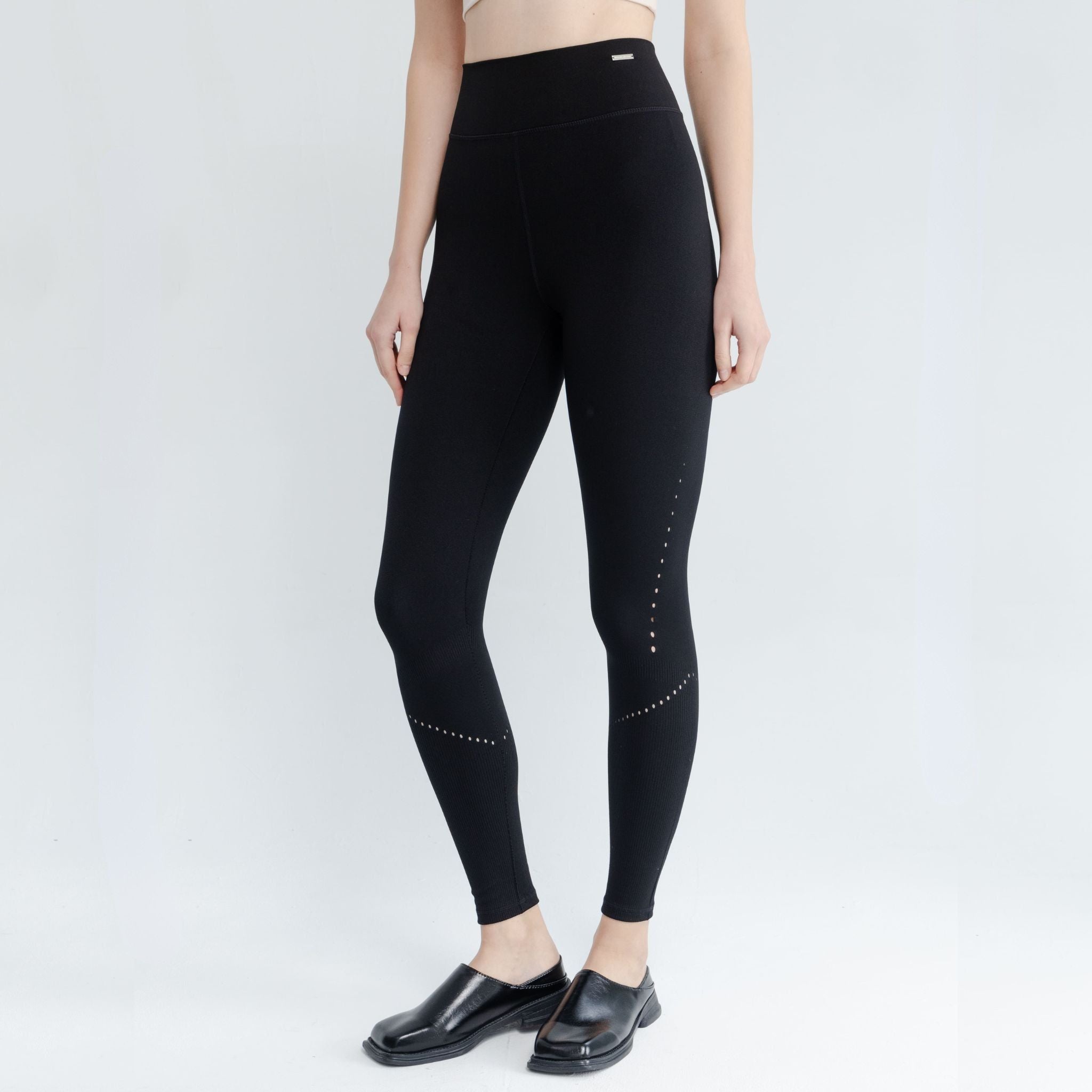 Sleek black leggings paired with sports bra for a complete gym outfit