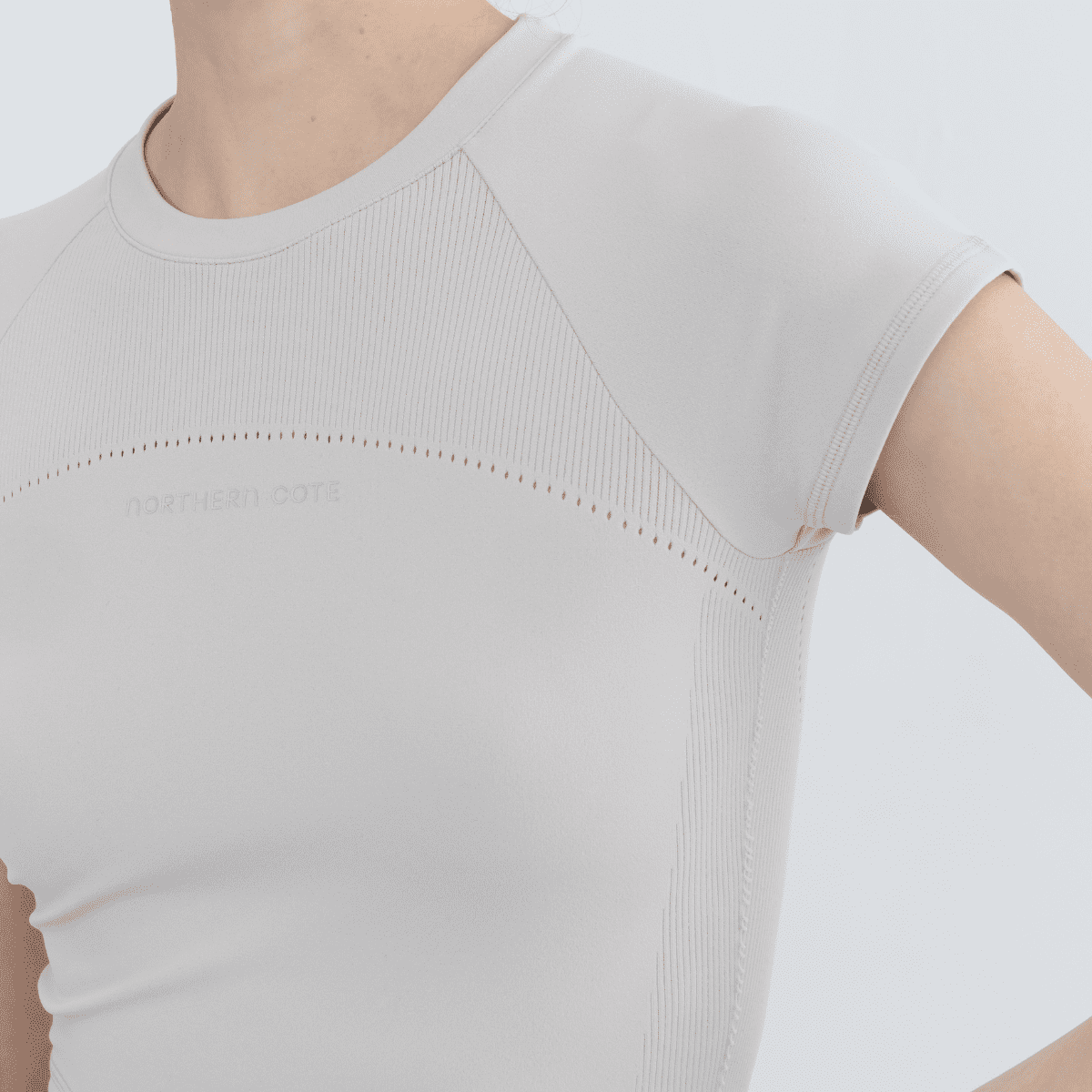 Detail shot of neckline and stitching on women's seamless tops made from recycled materials