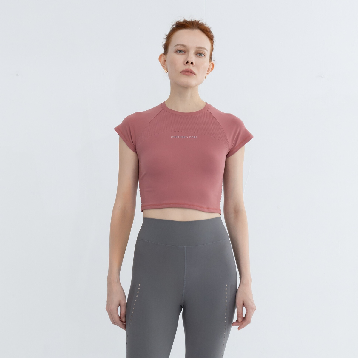seamless crop shirt paired with leggings for a full workout outfit