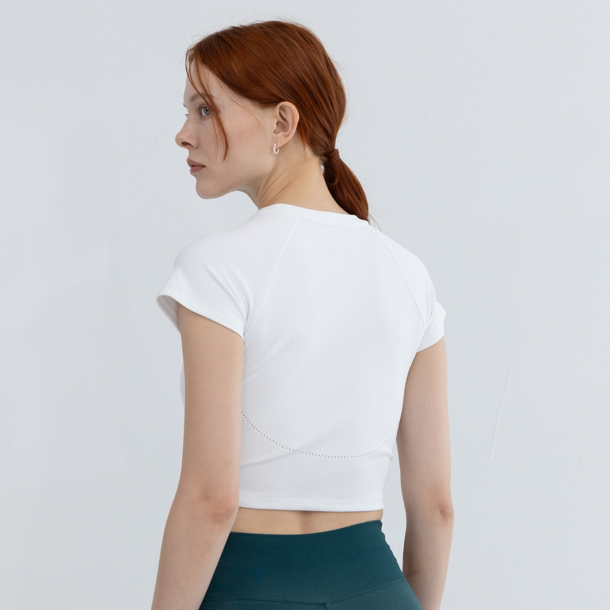 Back view of icy white crop seamless top