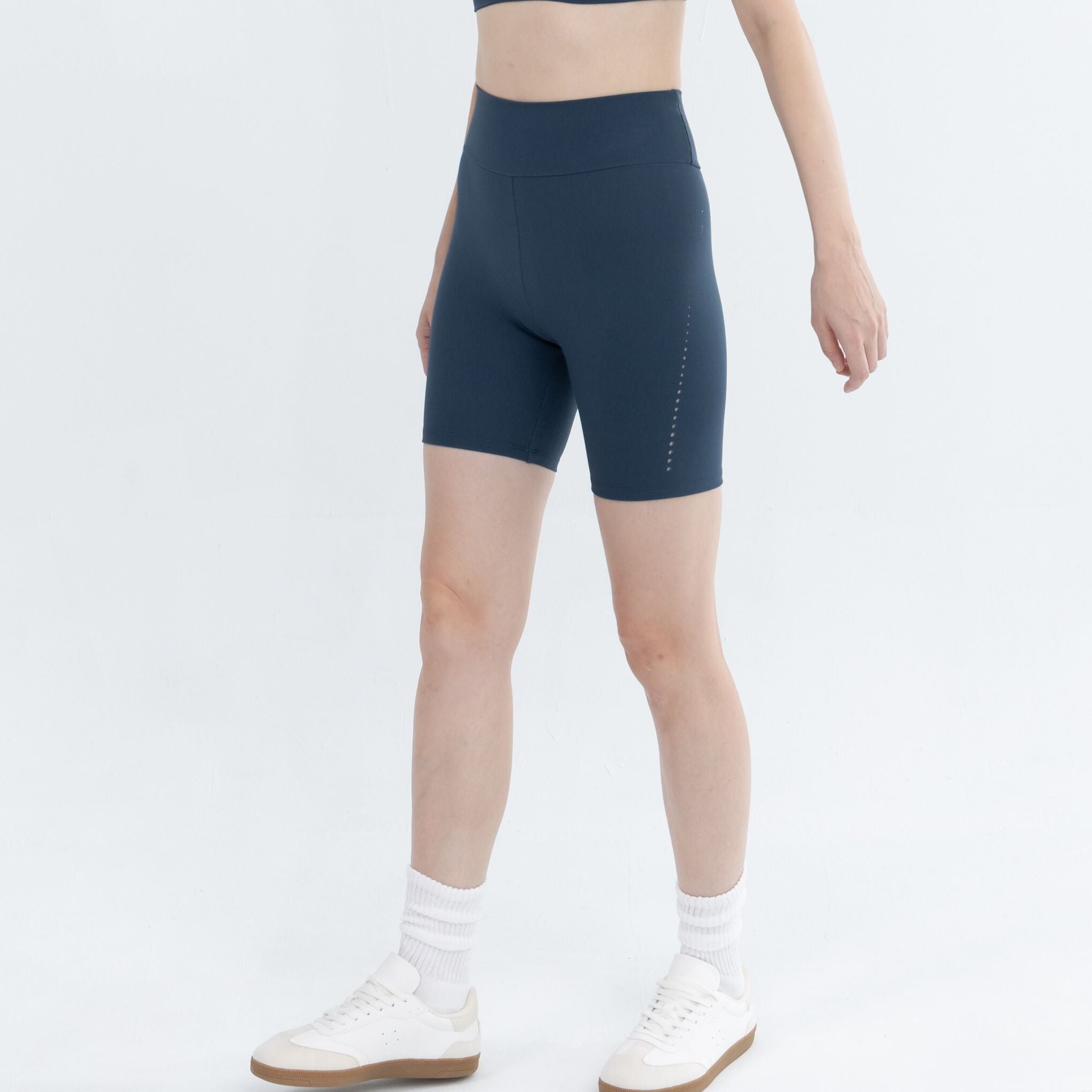 Athletic model in high-waist workout legging performing exercises