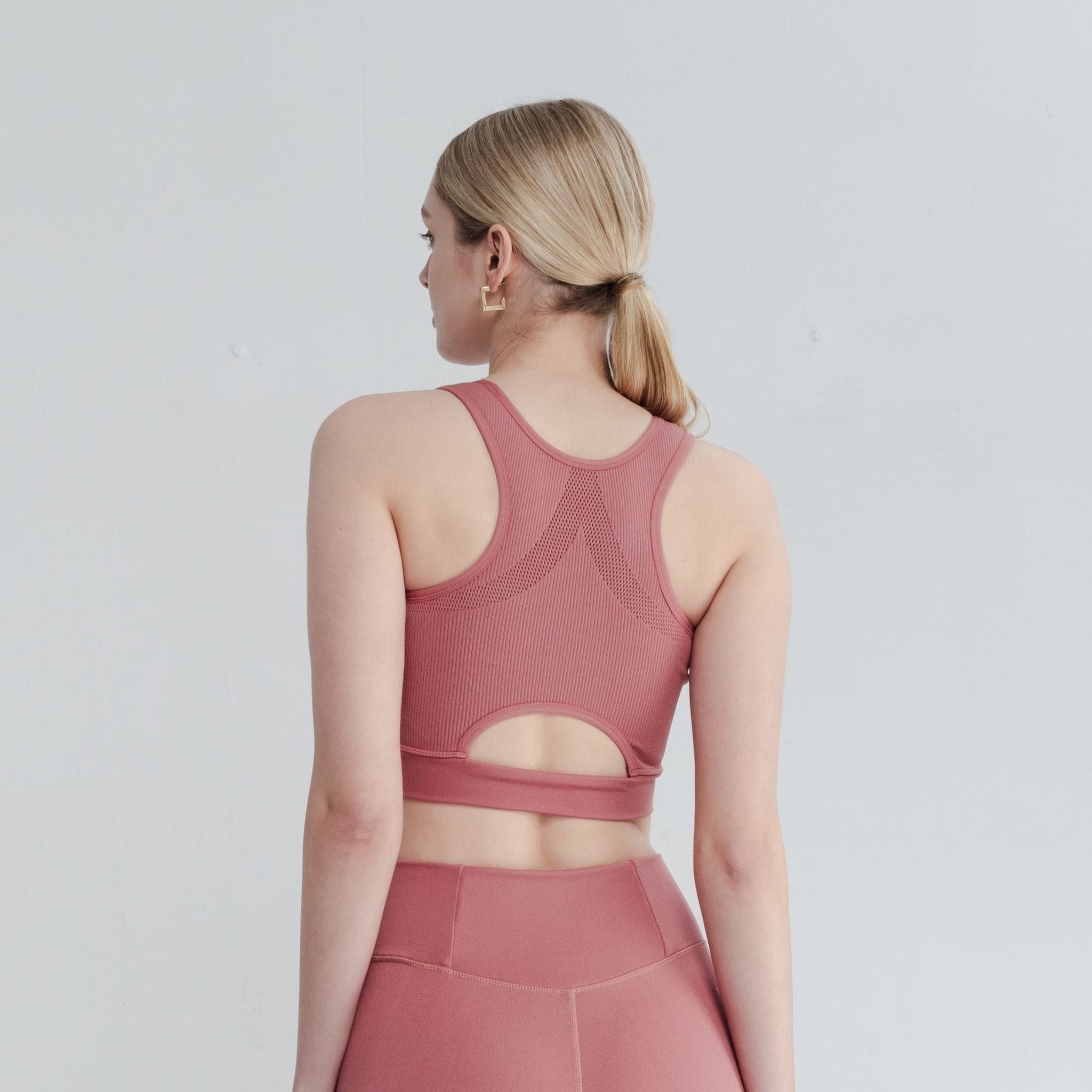 High Neck Bra for sleek activewear that transitions to street style.