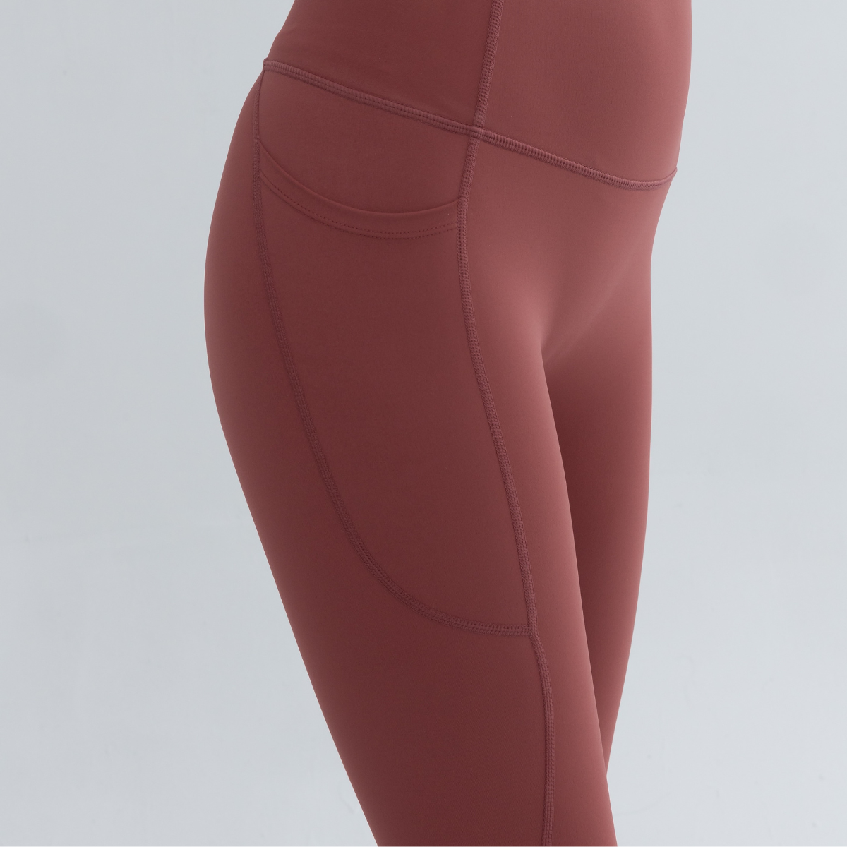 Close-up of performance leggings fabric showing soft, breathable texture.