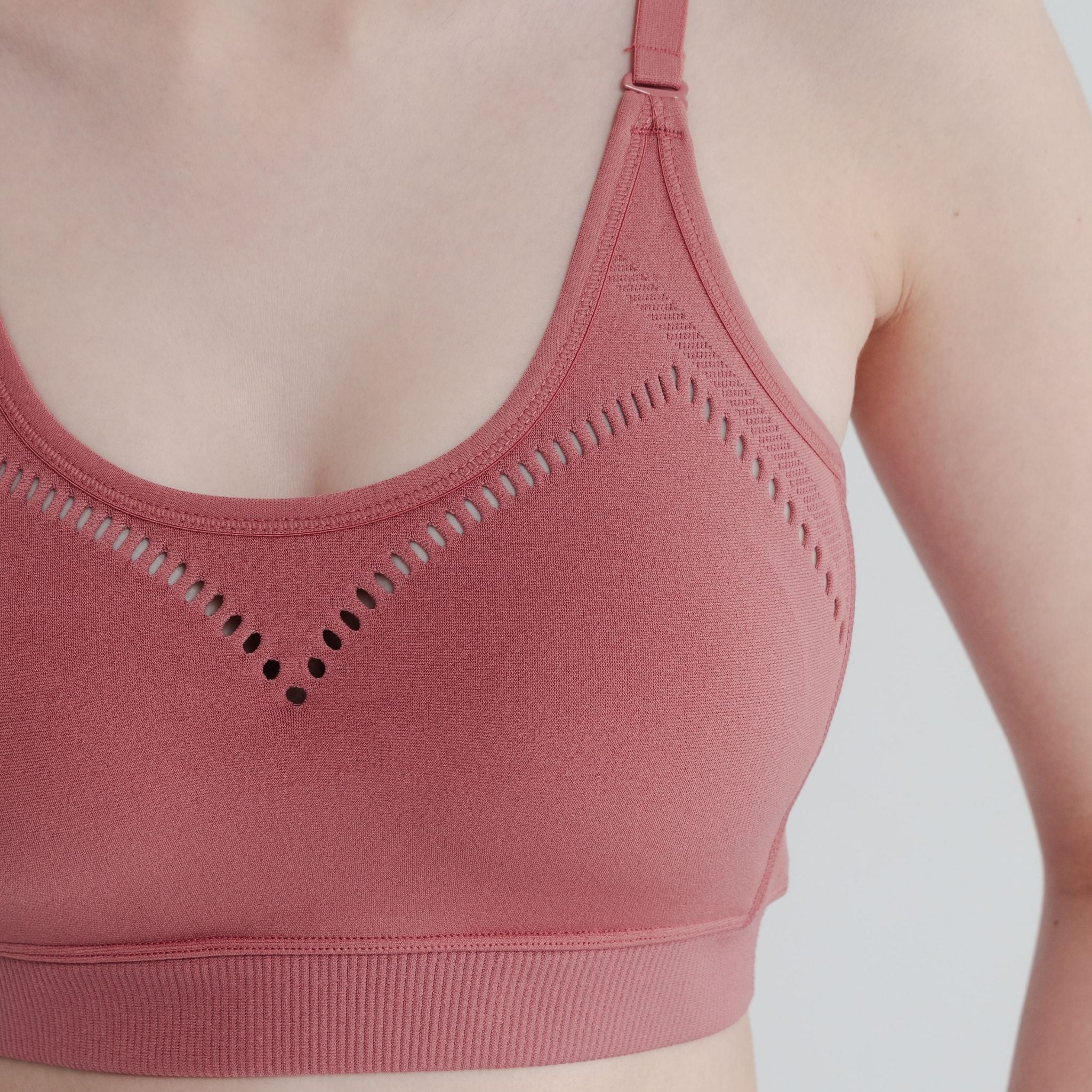 Close-up of seamless light support sports bra showing soft, stretchy fabric for all day comfort and endurance