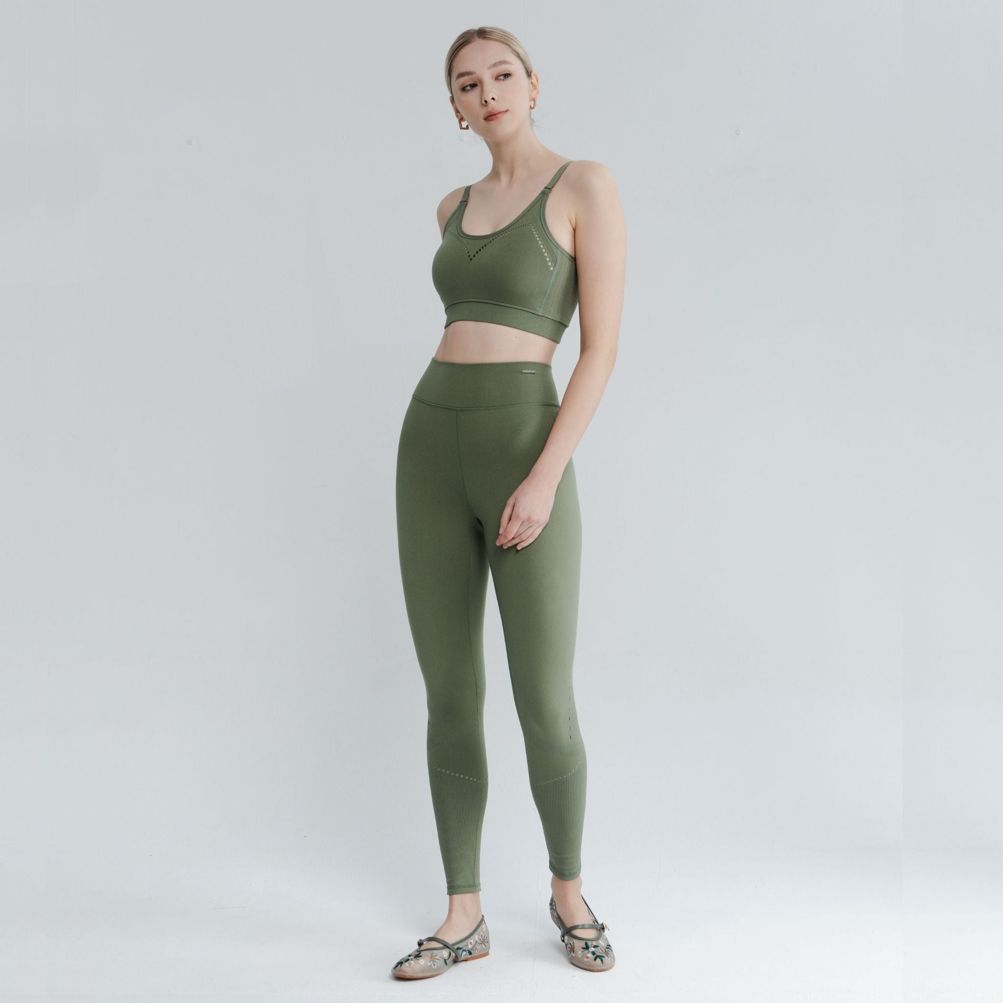 Model stretching in casual light support bra great for yoga, lounging, or light fitness routines