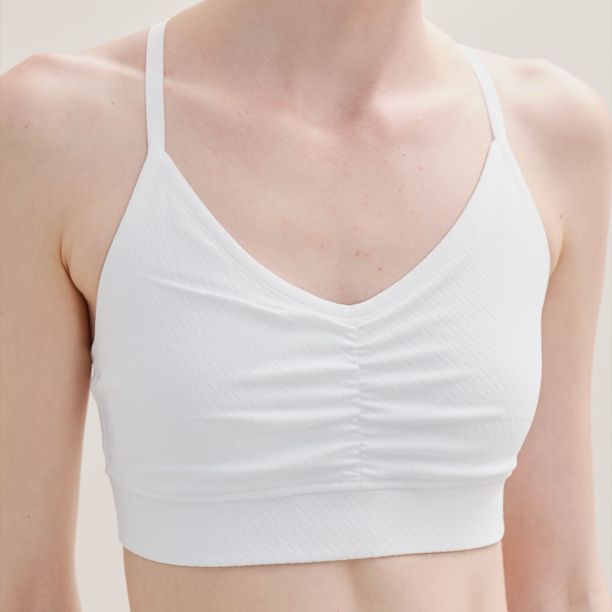 Front view of Cross Back Bralette with wide V-neck and seamless fit.