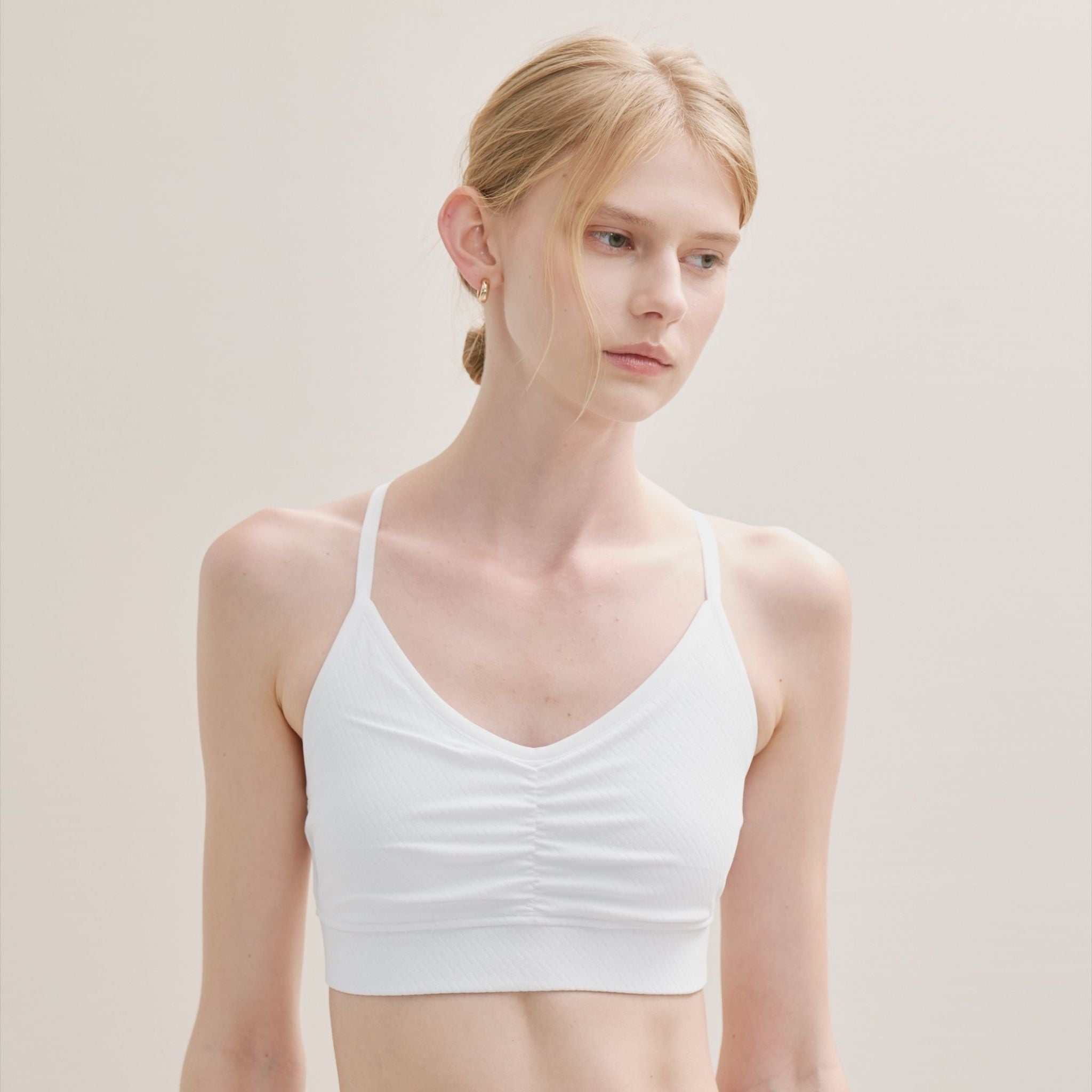 white Bra with Cross Back, styled for yoga or activewear.