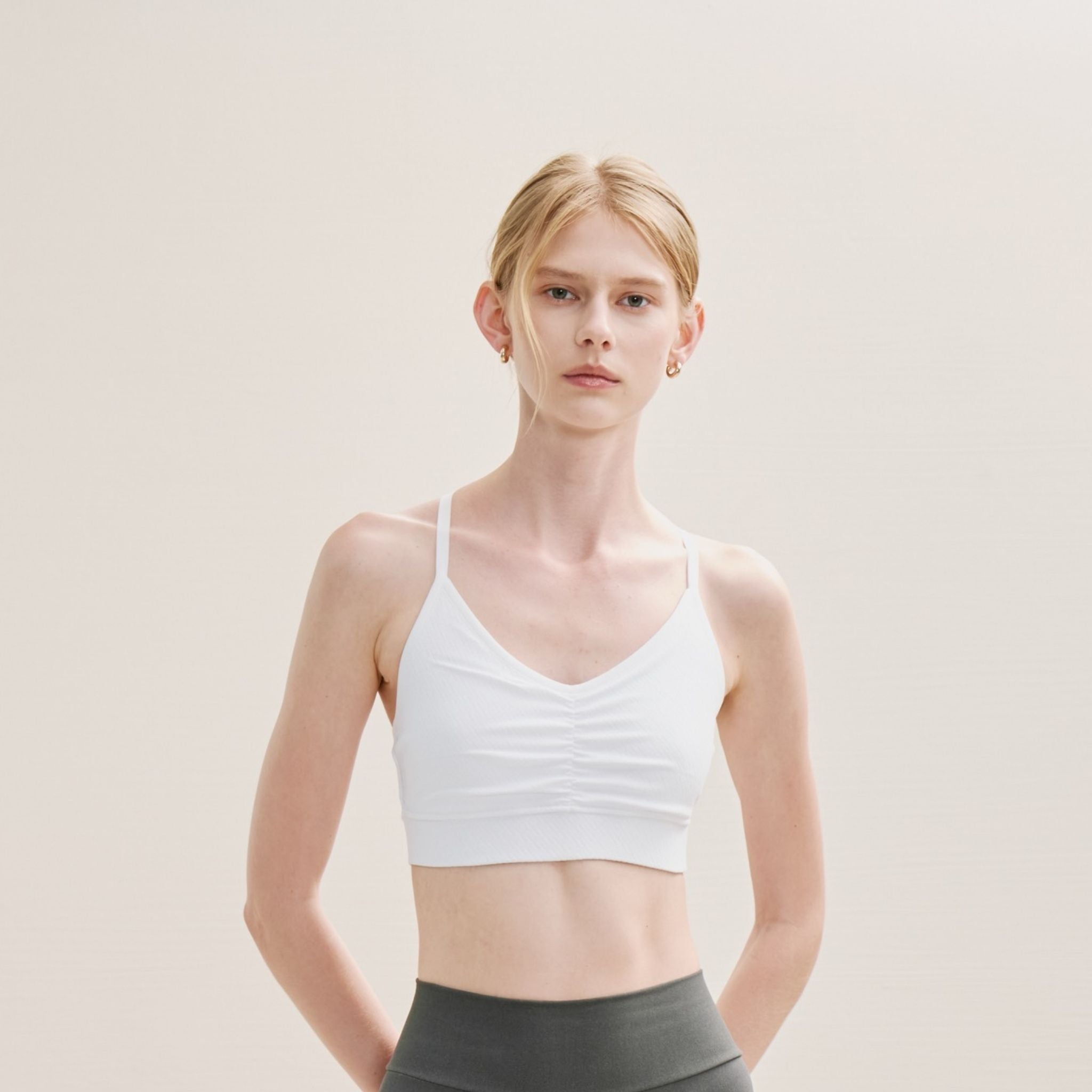 white Adjustable Cross Back Bra with medium support and ruched front.