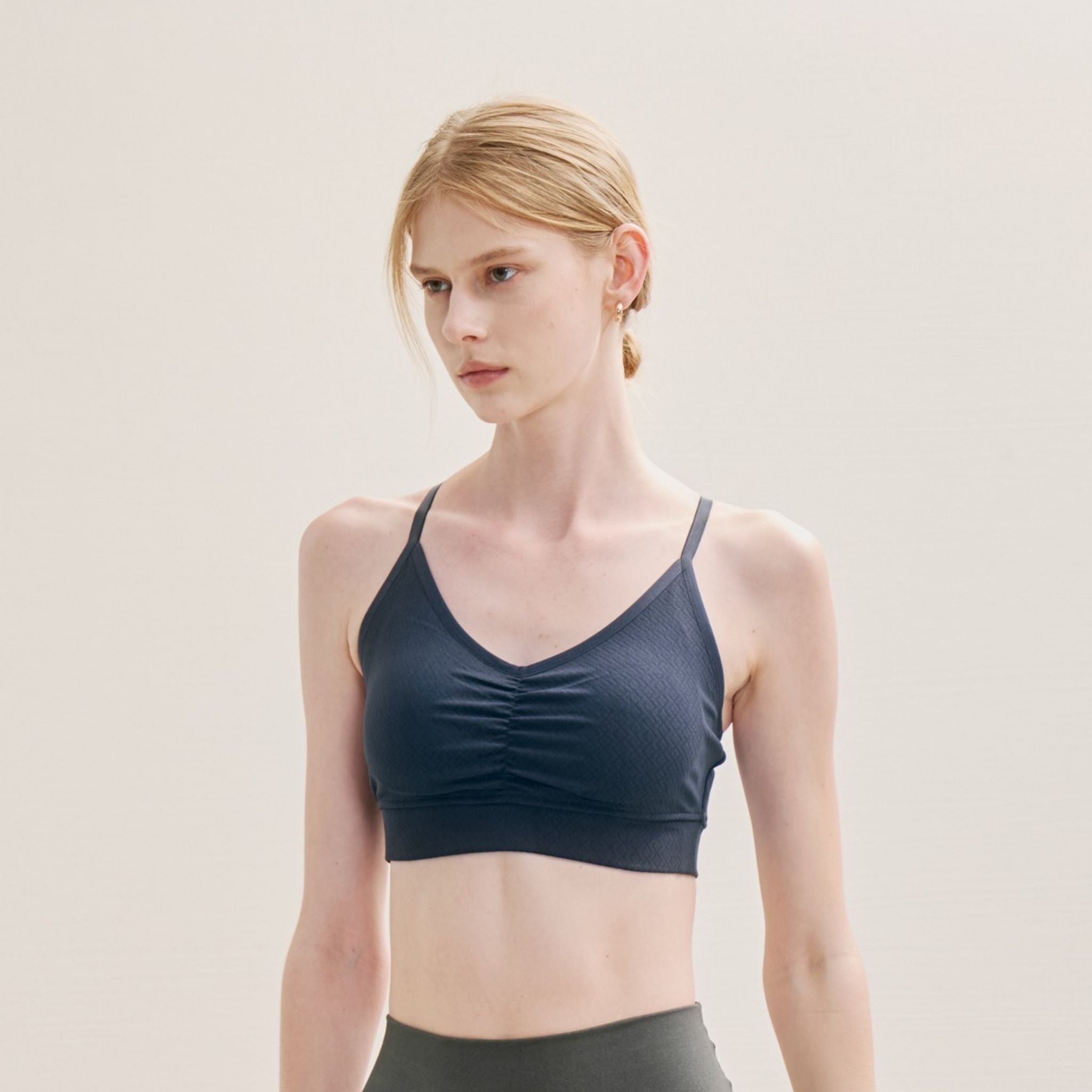 image of model in Crossed Back Bra paired with leggings.