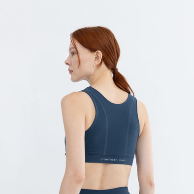 Side pose of model wearing best medium impact workout bra