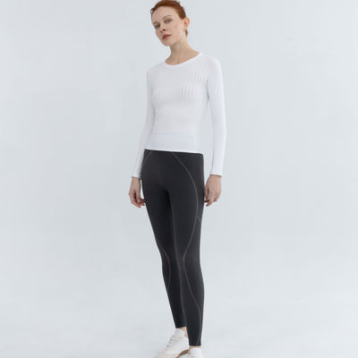 Pullover For Workouts modeled mid-stretch