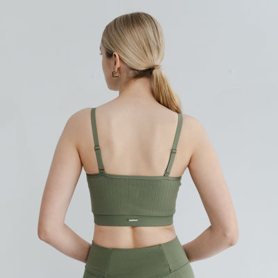 Back view of the fashionable olive open back bra showing the open bra back and adjustable straps for personalized comfort and style.