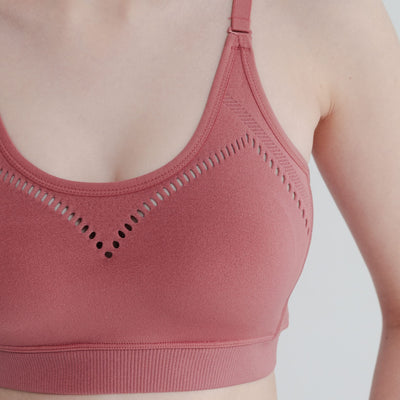 Close-up of seamless light support sports bra showing soft, stretchy fabric for all day comfort and endurance