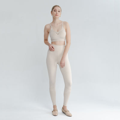 Model in motion wearing light support sports bra – designed for flexibility and everyday ease